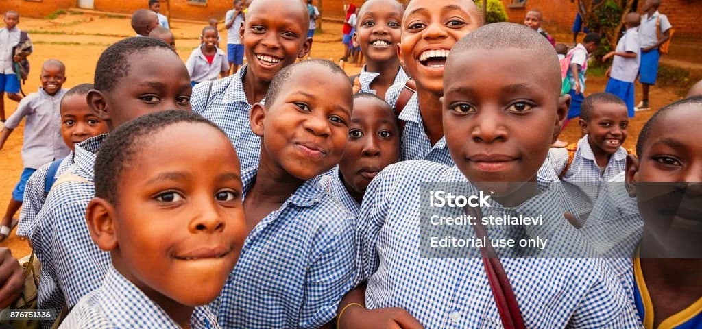 Happy African Kids Kigali, Rwanda- May 2017- Smiling group of elementary school kids in school uniform, Kigali, Rwanda Rwanda Stock Photo