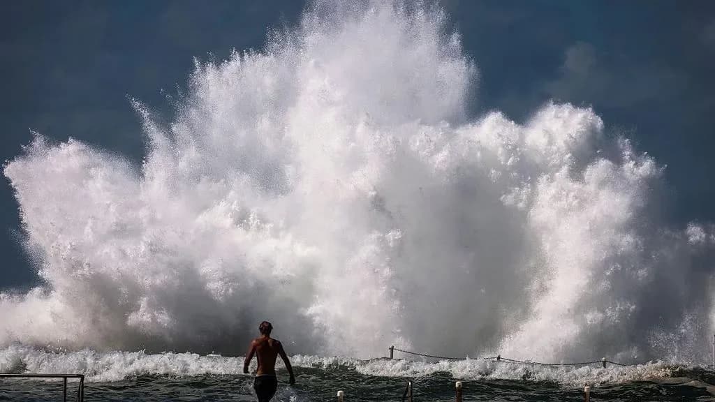 Death toll from huge waves hitting Australia’s coast rises to seven