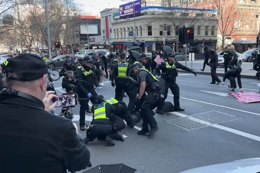 Four arrested in clashes between police and protesters in Melbourne CBD