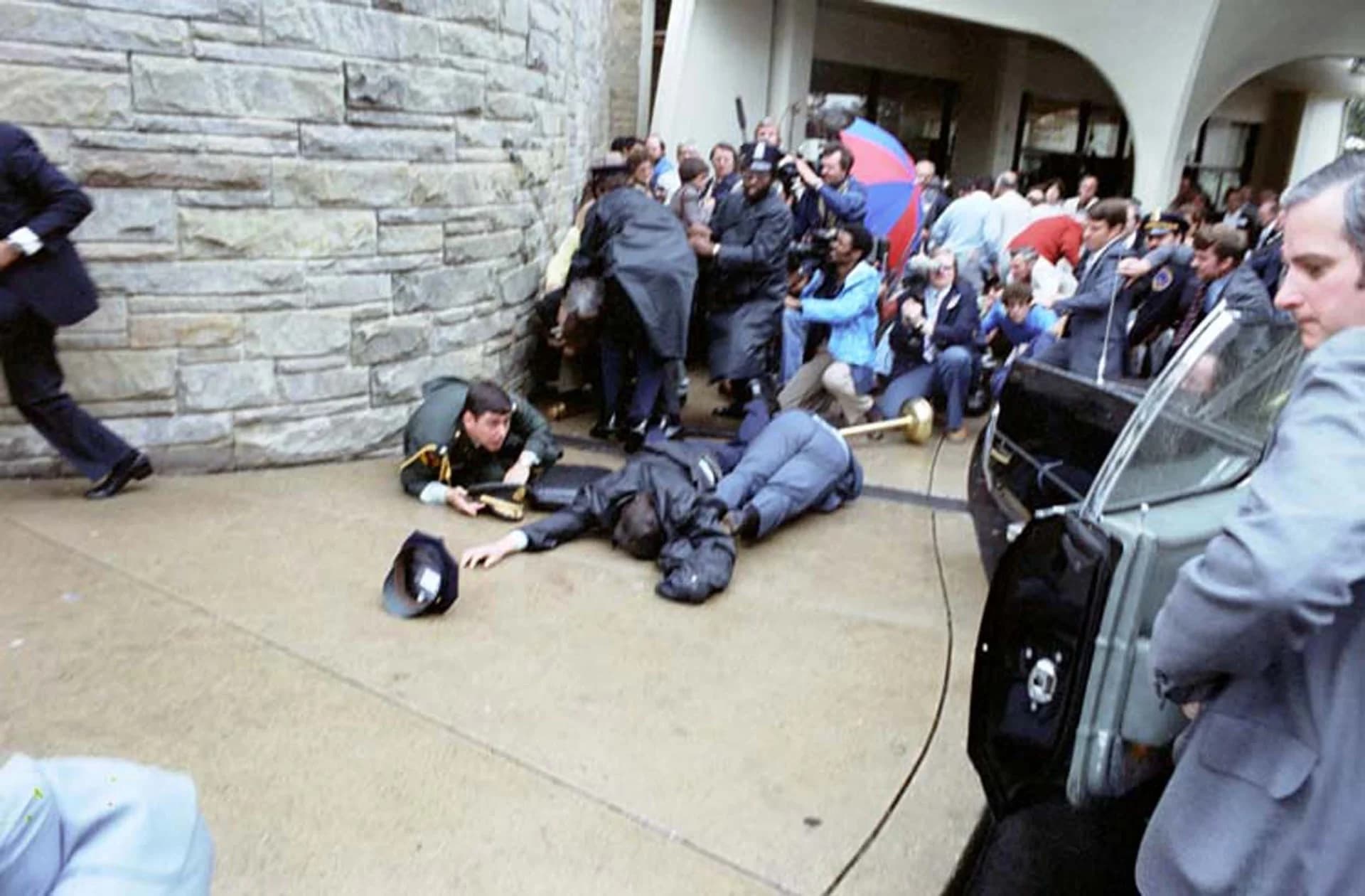 President Reagan waves to the crowd immediately before being shot outside the Washington Hilton Hotel
