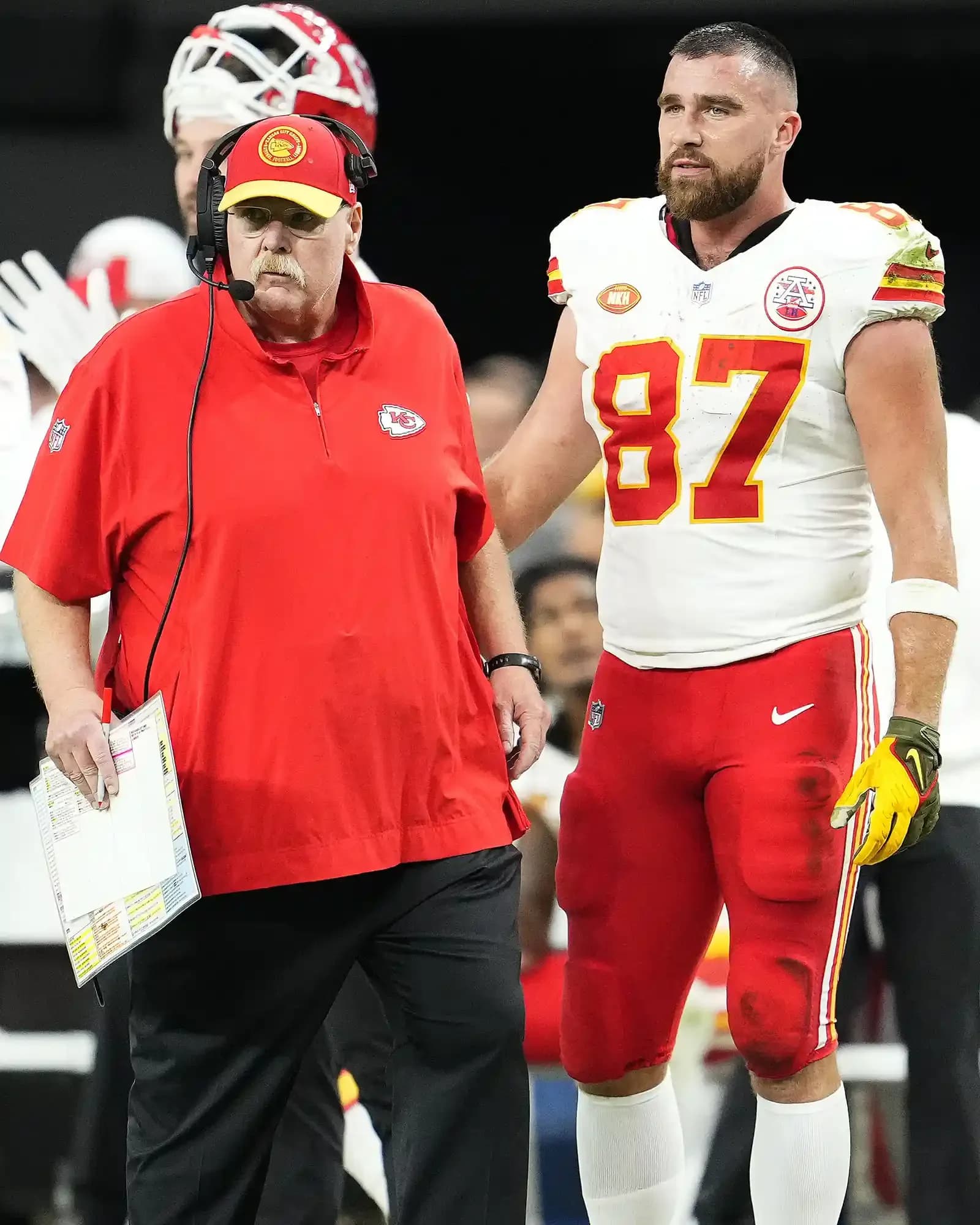Head coach Andy Reid and Travis Kelce #87 of the Kansas City Chiefs look on during the second quarter of a game against the Las Vegas Raiders at Allegiant Stadium on November 26, 2023 in Las Vegas, Nevada. 