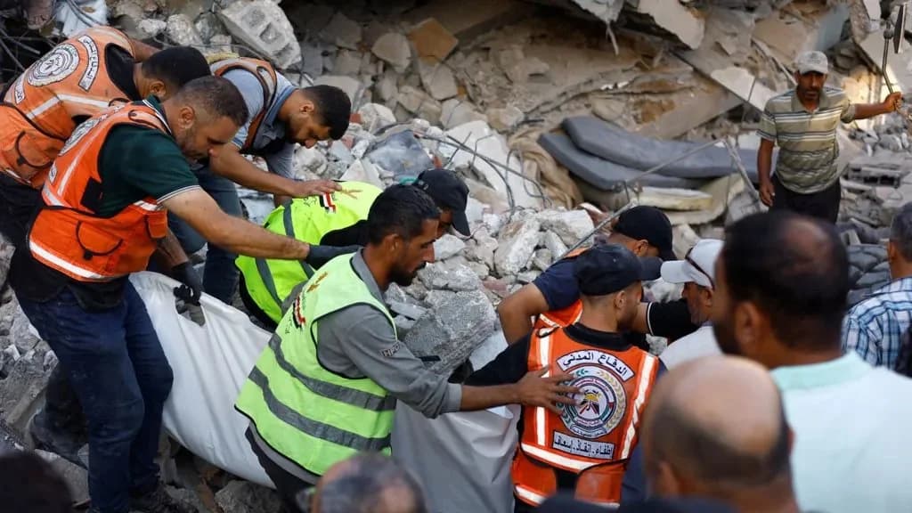 War-damaged building collapses in Gaza, killing at least 21 people