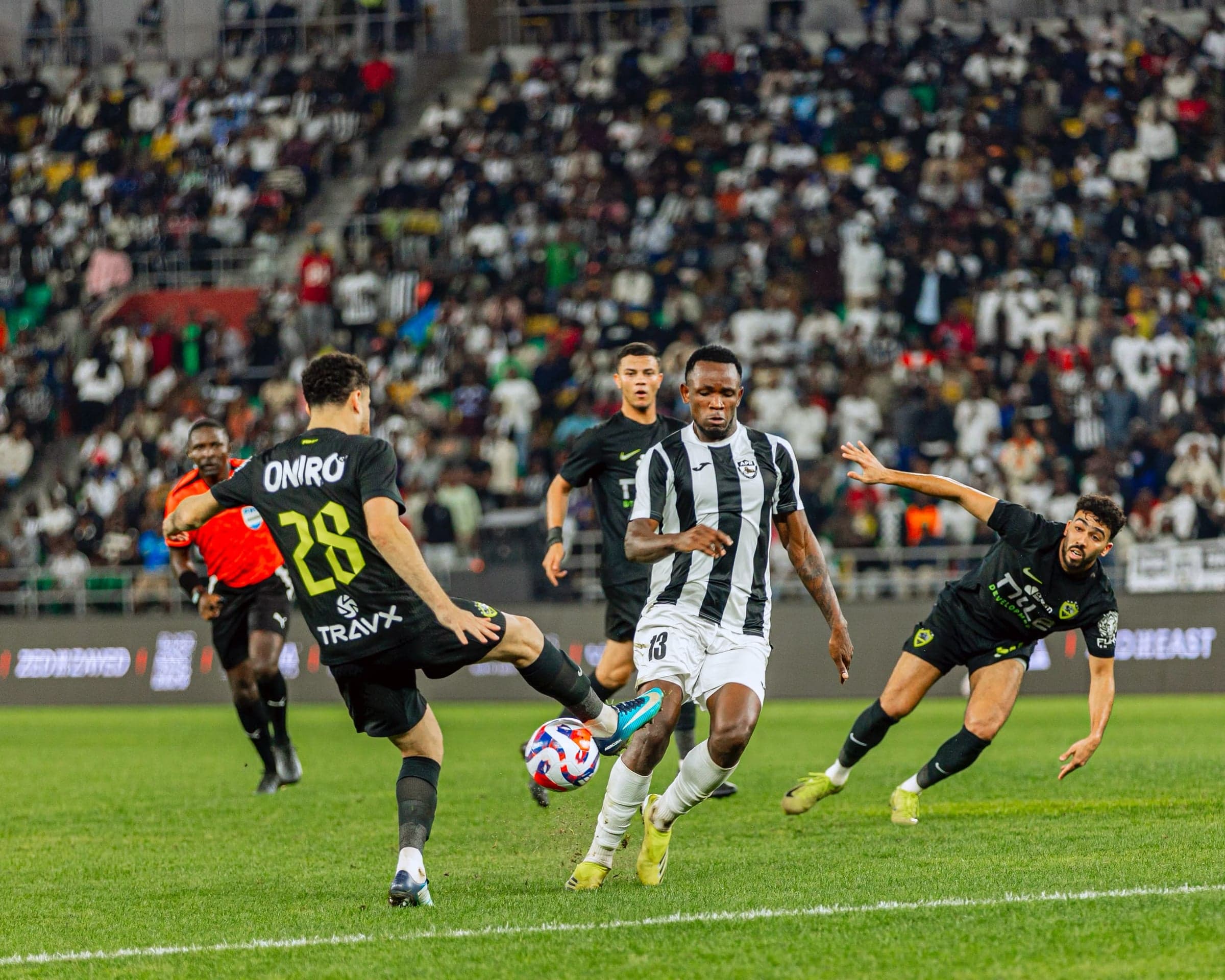 APR FC’s Uwiyaremye Fidali battles to keep possession with Zamalek players closing in during their CAF Champions League clash.
